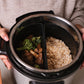 image with beef and chicken in one pressure cooker pocket and rice in another pocket